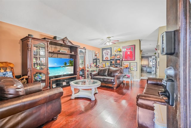 living room featuring hardwood / wood-style floors and ceiling fan