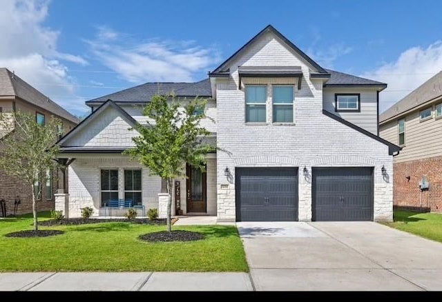 view of front facade featuring a front lawn and a garage