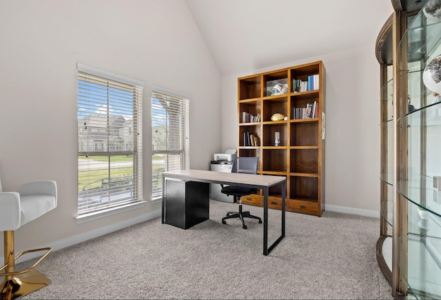 office featuring light colored carpet and lofted ceiling