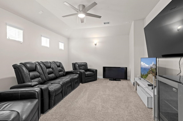 carpeted cinema room featuring ceiling fan