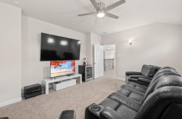 carpeted living room featuring ceiling fan and lofted ceiling