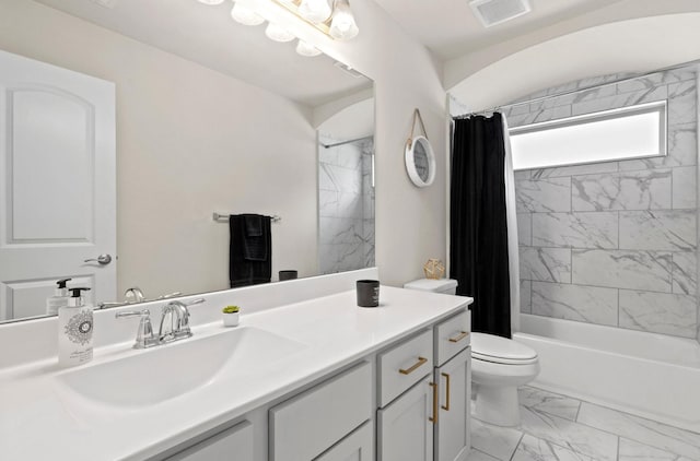 full bathroom featuring toilet, vanity, and shower / bath combo with shower curtain