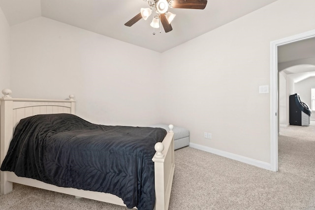 bedroom with carpet flooring, lofted ceiling, and ceiling fan