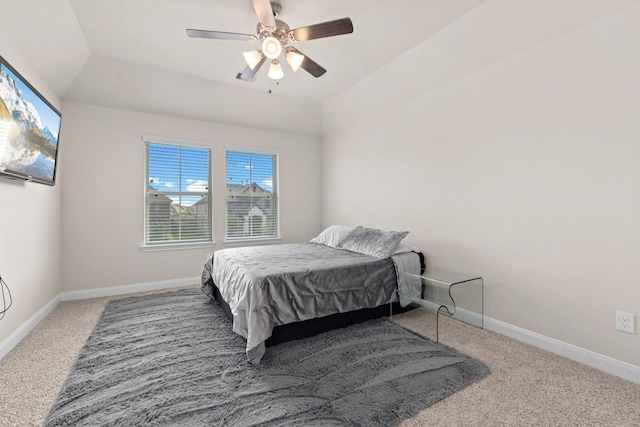 carpeted bedroom with lofted ceiling and ceiling fan