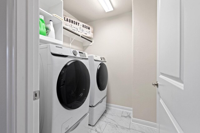 washroom with independent washer and dryer