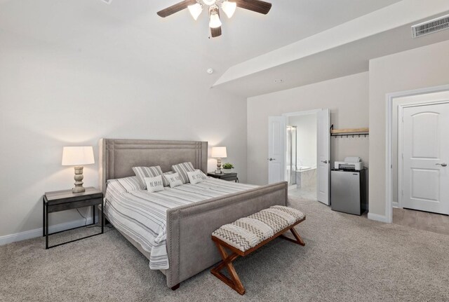 carpeted bedroom with connected bathroom and ceiling fan