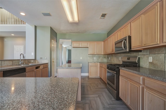 kitchen featuring backsplash, a textured ceiling, dark parquet floors, stainless steel appliances, and sink