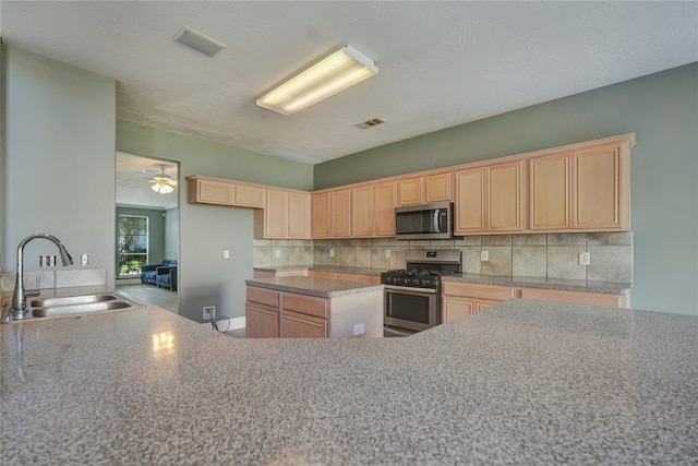 kitchen featuring ceiling fan, sink, stainless steel appliances, and light brown cabinets