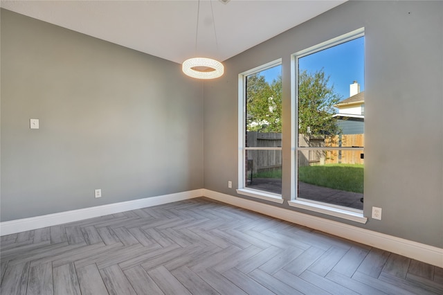 spare room featuring light parquet flooring