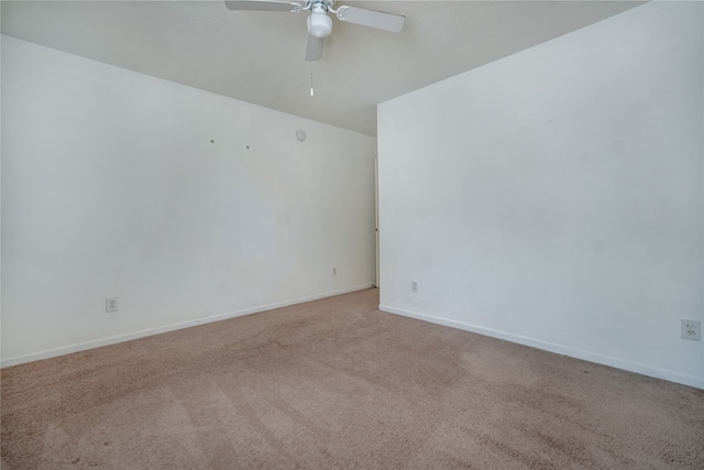 empty room with ceiling fan and light colored carpet