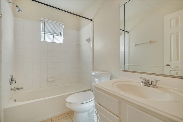 full bathroom with tile patterned flooring, vanity, toilet, and tiled shower / bath