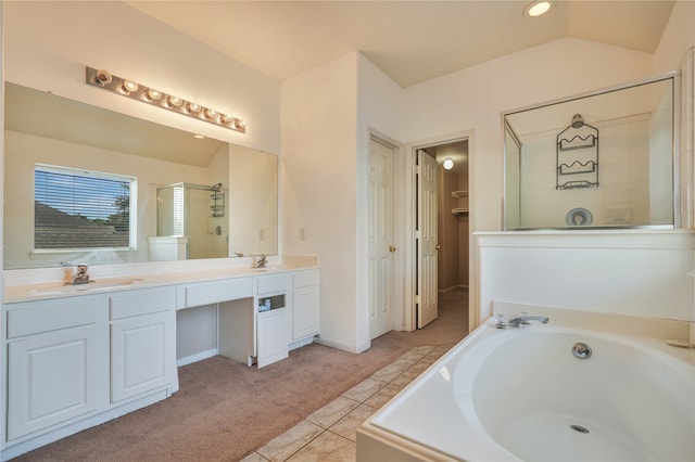 bathroom with tile patterned floors, vanity, plus walk in shower, and vaulted ceiling