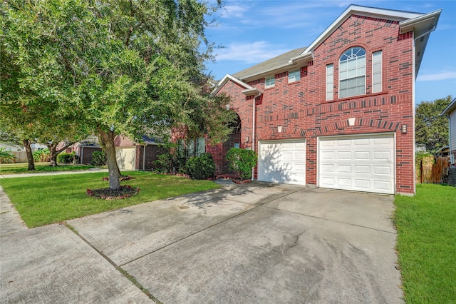 view of property with a garage and a front yard