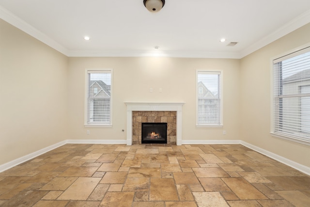 unfurnished living room with ornamental molding and a fireplace