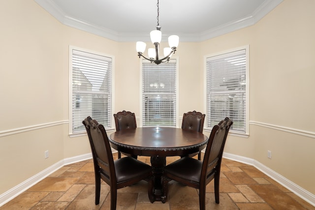 dining area featuring a notable chandelier and crown molding