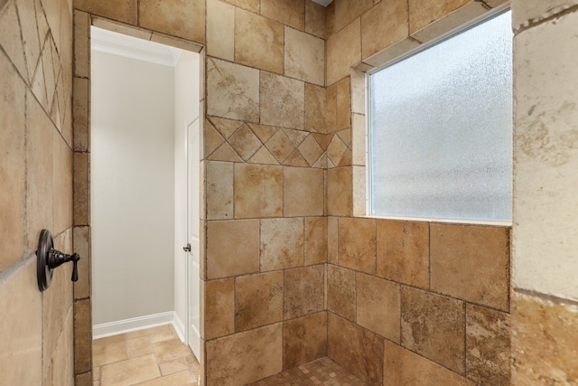 bathroom with tiled shower