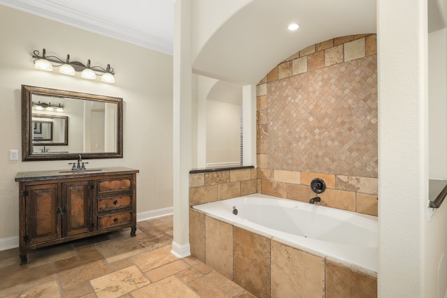 bathroom featuring a relaxing tiled tub, vanity, and crown molding