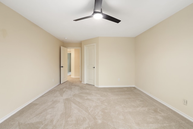 unfurnished bedroom featuring light colored carpet and ceiling fan