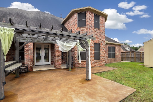 back of house featuring a yard, a pergola, french doors, and a patio area