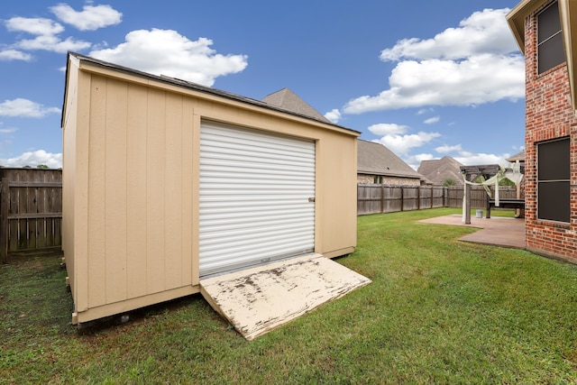 view of outbuilding featuring a lawn