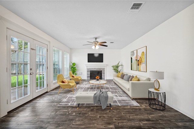 living room featuring french doors, dark hardwood / wood-style flooring, and ceiling fan