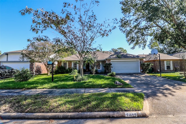 ranch-style house featuring a garage and a front lawn