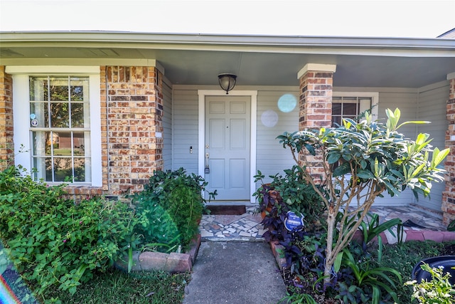 doorway to property featuring a porch