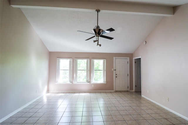 tiled empty room featuring lofted ceiling with beams and ceiling fan