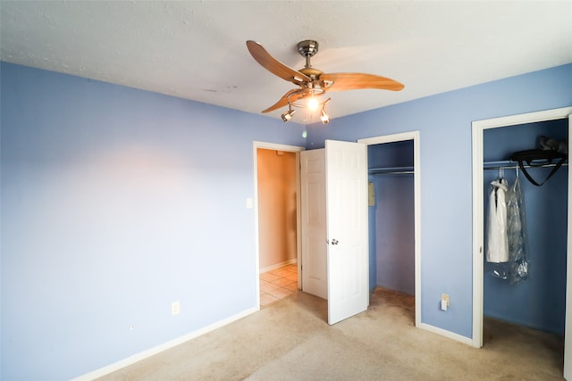 unfurnished bedroom with light carpet and ceiling fan