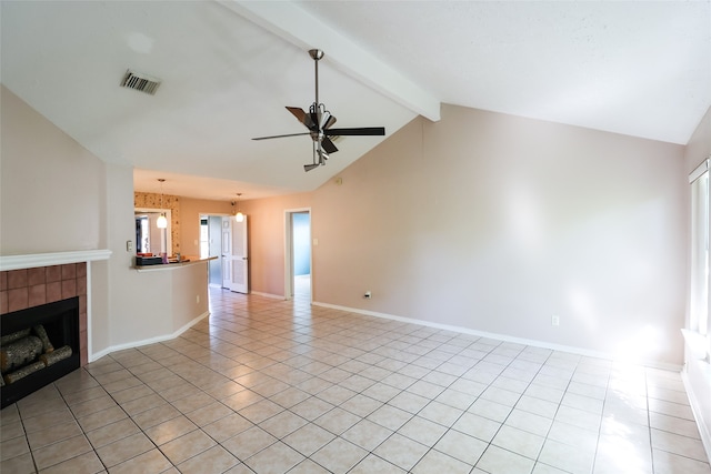 unfurnished living room featuring ceiling fan, a fireplace, light tile patterned flooring, and lofted ceiling with beams