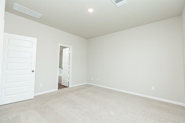 spare room with light carpet