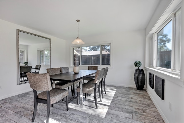 dining space featuring light wood-type flooring