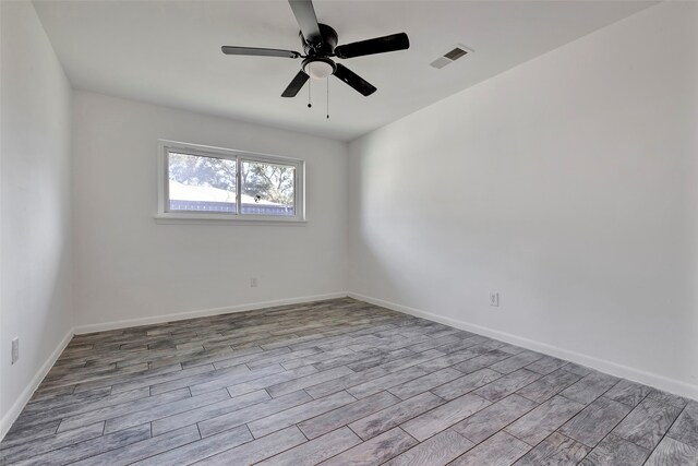 empty room featuring light hardwood / wood-style floors and ceiling fan