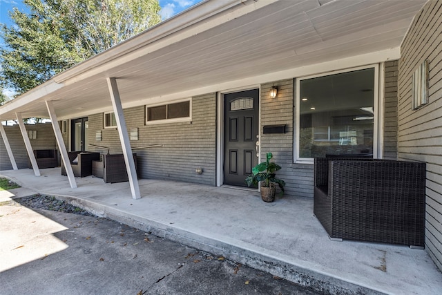 property entrance featuring a patio area