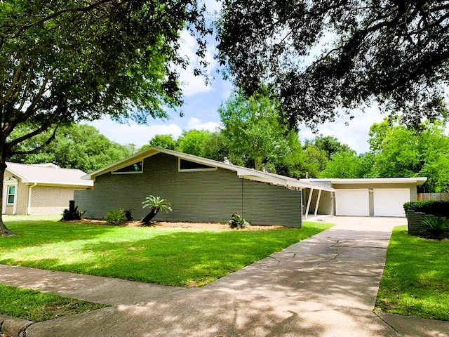 ranch-style home featuring a garage and a front lawn