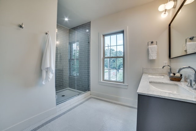 bathroom with vanity, tile patterned flooring, and a shower with door