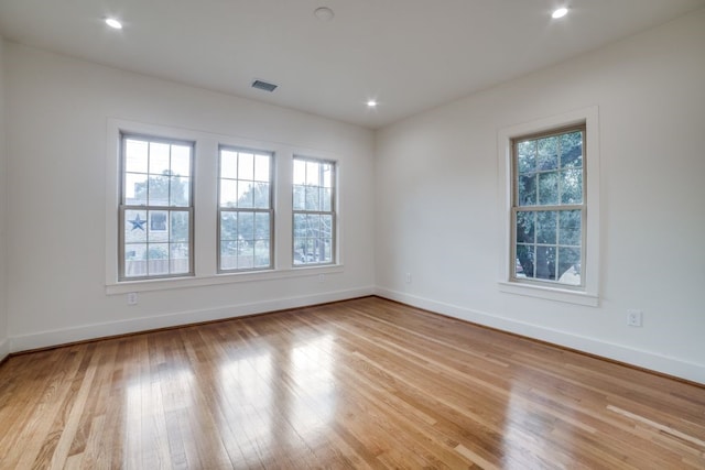 unfurnished room with light hardwood / wood-style floors