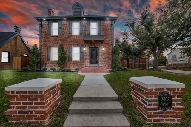 view of front of home with a yard