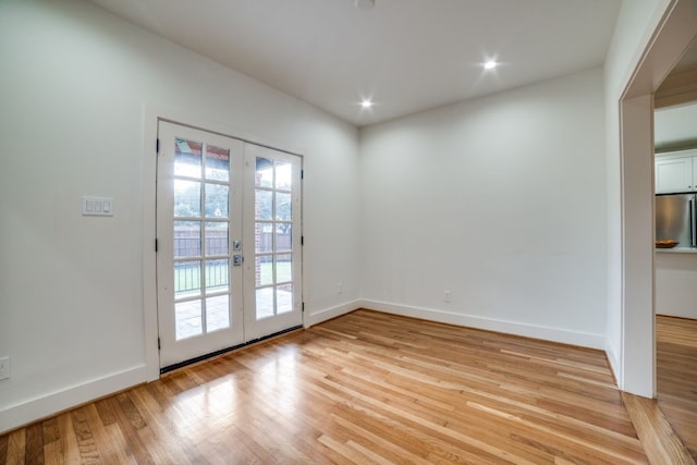 interior space featuring french doors and light hardwood / wood-style flooring