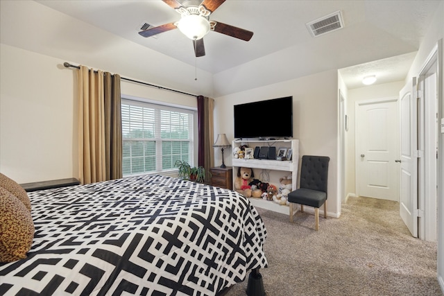 carpeted bedroom with ceiling fan and lofted ceiling