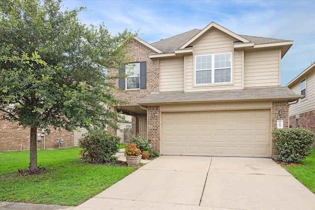 view of front facade featuring a front lawn and a garage