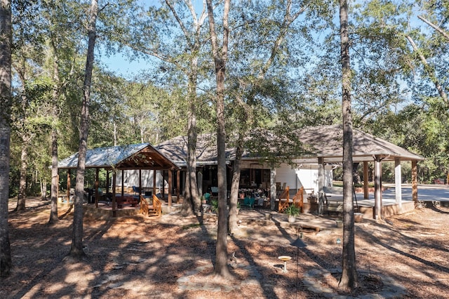 rear view of property with a gazebo