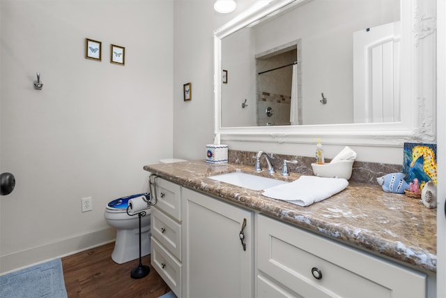 bathroom with vanity, toilet, wood-type flooring, and curtained shower