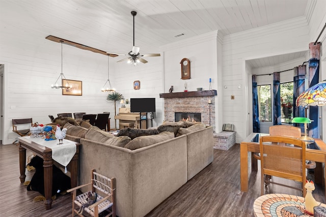 living room with ceiling fan, dark wood-type flooring, wood walls, and wooden ceiling