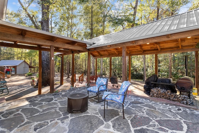 view of patio with an outbuilding