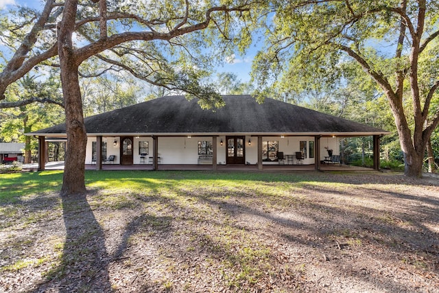 ranch-style house featuring french doors