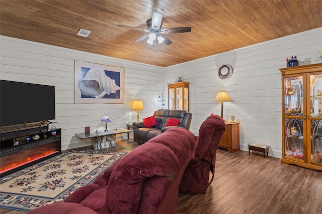 living room with ceiling fan, wood ceiling, and dark hardwood / wood-style floors