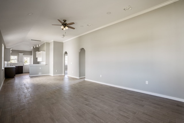 unfurnished living room featuring dark wood-type flooring, lofted ceiling, sink, ornamental molding, and ceiling fan