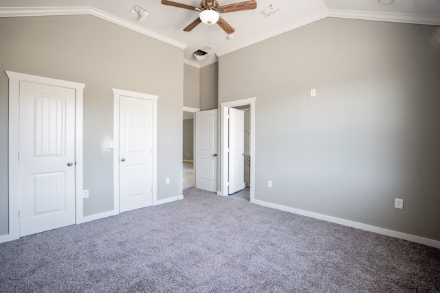 unfurnished bedroom featuring high vaulted ceiling, ceiling fan, ornamental molding, and carpet floors