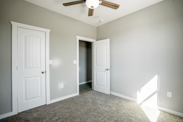 unfurnished bedroom featuring carpet and ceiling fan